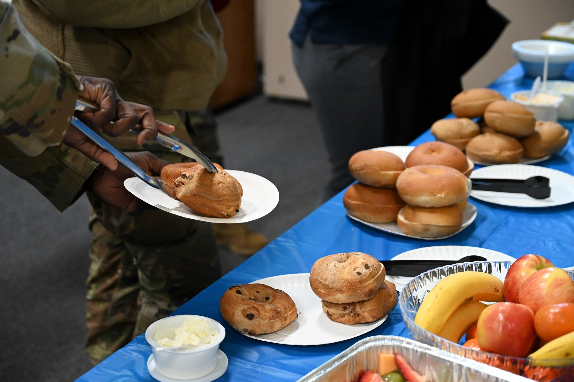 People in uniform at breakfast.