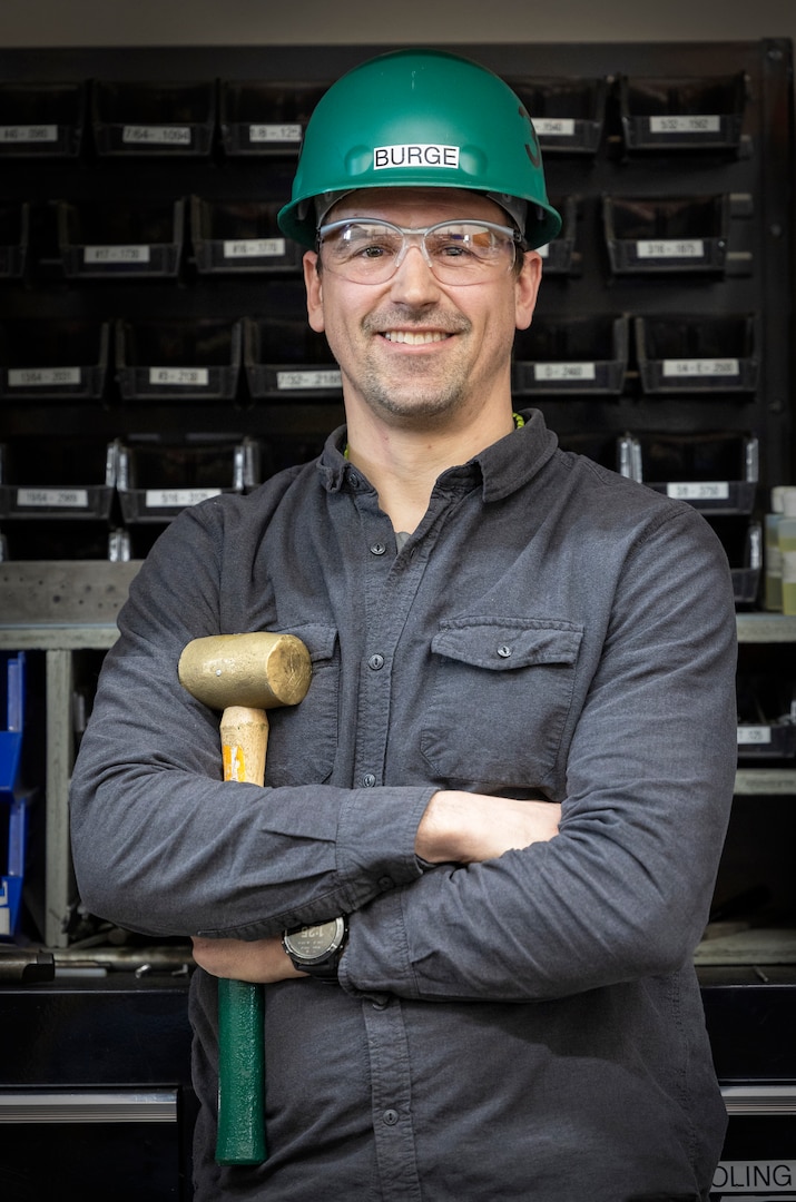 Brian Burge, NSS-SY trade expert, Shop 38, Marine Machinists, takes a stack height measurement on a ball and seats March 8, 2023, at Puget Sound Naval Shipyard & Intermediate Maintenance Facility in Bremerton, Washington. (U.S. Navy photo by Wendy Hallmark)