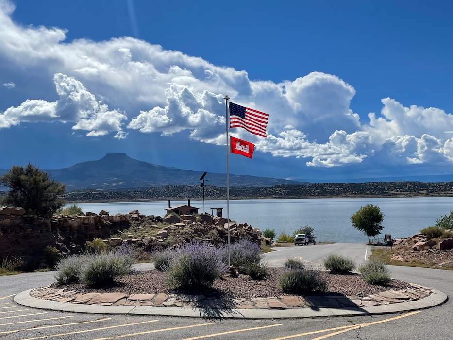 ABIQUIU LAKE, N.M. – The American and USACE flags fly at the Abiquiu Lake boat ramp as monsoons build up over Cerro Pedernal, Oct. 8, 2022. Photo by Brady Dunne. This year there was a three-way tie for third place. 