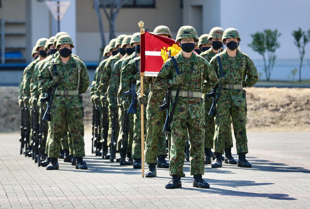 Members of the Japan Ground Self-Defense Force at Camp Zama stand at attention on the parade deck March 4 for a ceremony marking the JGSDF’s 10-year anniversary co-located on the installation with the U.S. Army in Japan.