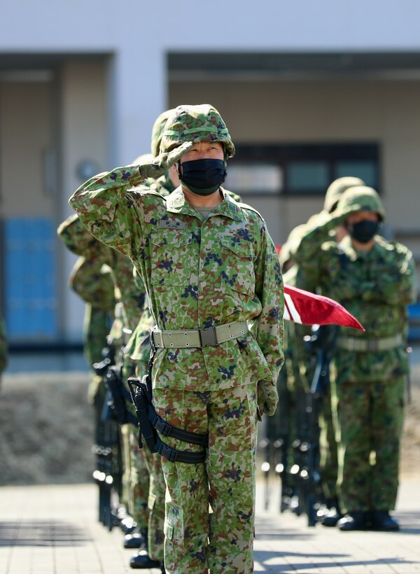 Members of the Japan Ground Self-Defense Force at Camp Zama salute their leadership March 4 during a ceremony marking the JGSDF’s 10-year anniversary co-located on the Camp Zama with the U.S. Army in Japan.