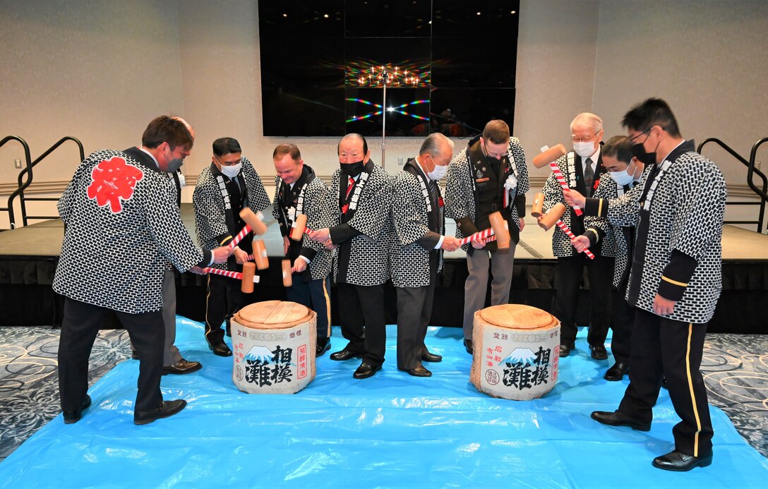 Senior leaders participate in a “kagami biraki” ceremony in which they break open a Japanese sake barrel during a March 4 event marking the 10th anniversary of the Japan Ground Self-Defense Force being co-located on Camp Zama with the U.S. Army in Japan. (Photo courtesy of the Japan Ground Self-Defense Force)