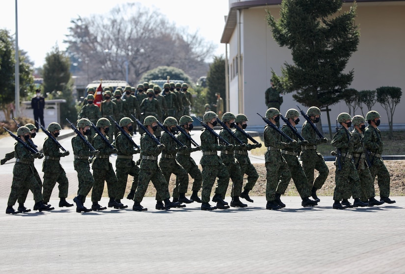 Members of the Japan Ground Self-Defense Force at Camp Zama march onto the parade deck March 4 for a ceremony marking the JGSDF’s 10-year anniversary co-located on the installation with the U.S. Army in Japan.