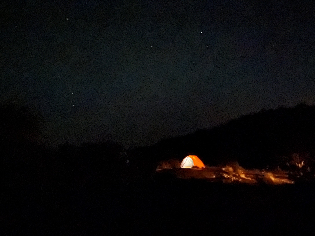 ABIQUIU LAKE, N.M. – A tent is illuminated under the night sky at the lake’s Riana Campground, May 2022. Photo by Pamela Bowie.