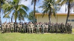 Airmen assigned to the 3rd Air Expeditionary Wing pose for a group photo during Exercise Agile Reaper 23-1 at Andersen Air Force Base, Guam, March 7, 2023. Agile Reaper 23-1 is the 3rd Air Expeditionary Wing’s effort to exercise Agile Combat Employment and allows personnel to rehearse capabilities to provide air dominance, global mobility, and command/control for the U.S. Indo-Pacific Command commander. (U.S. Air Force photo by Airman 1st Class Julia Lebens)
