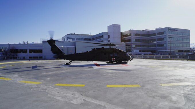 An Alaska Army National Guard HH-60M Black Hawk Helicopter assigned to Golf Company, Detachment 2, 2-211th General Support Aviation Battalion, transfers a notional casualty to Providence Alaska Medical Center in Anchorage, Alaska, March 13, 2023.
