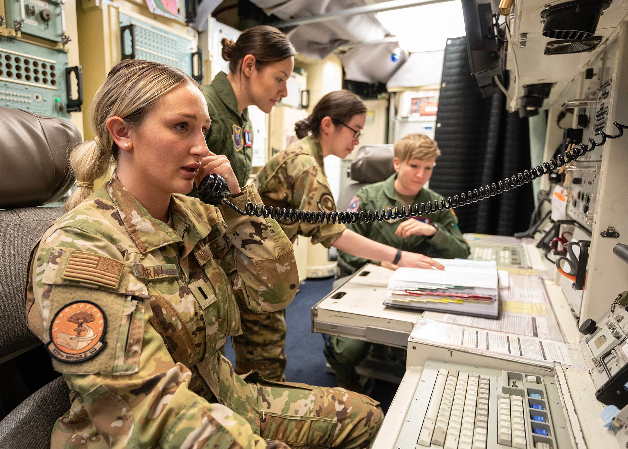 four female missileers prep for turnover