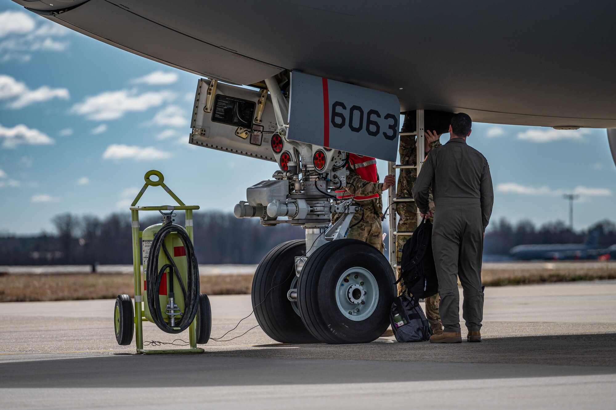 U.S. Air Force Airmen assigned to the 305th Air Mobility Wing conduct an Engine Running Crew Change (ERCC) during exercise White Stag at Joint Base McGuire-Dix-Lakehurst, N.J., March 8, 2023.