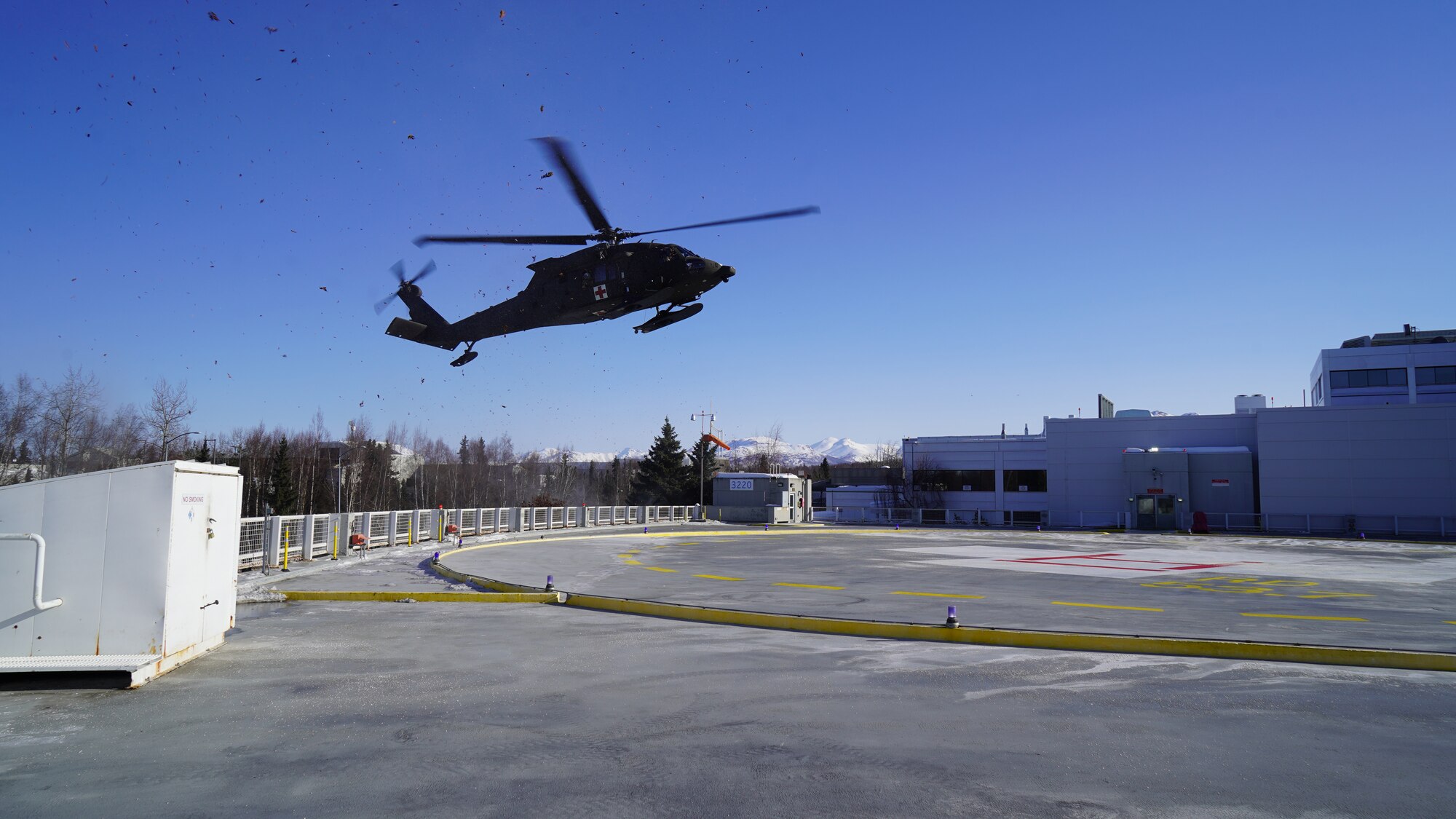 An Alaska Army National Guard HH-60M Black Hawk Helicopter assigned to Golf Company, Detachment 2, 2-211th General Support Aviation Battalion, prepares to land and transfer a notional casualty to Providence Alaska Medical Center in Anchorage, Alaska, March 13, 2023.