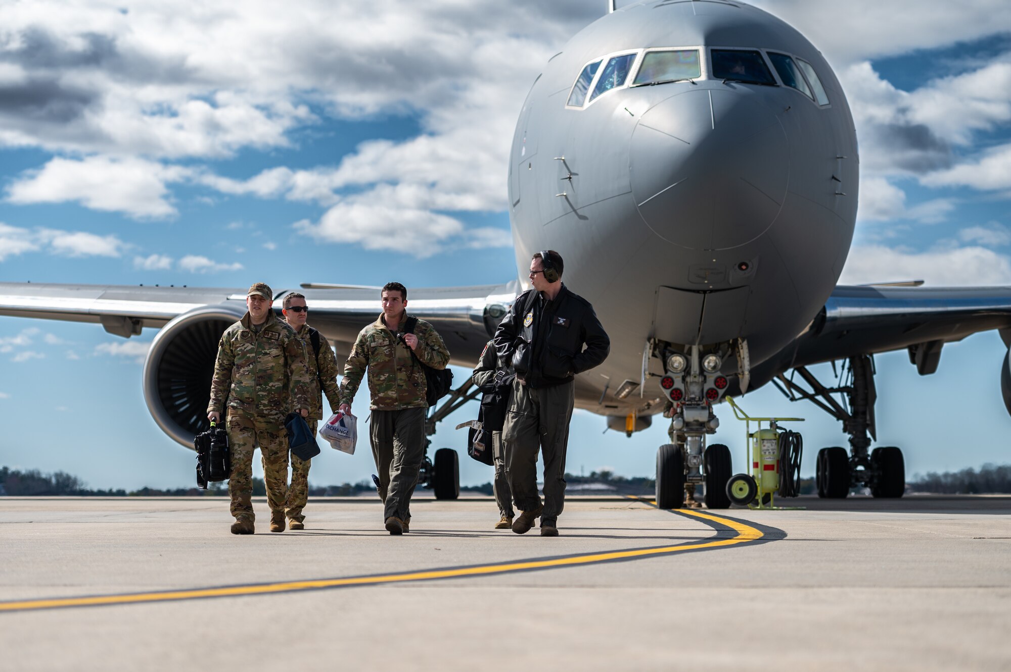 U.S. Air Force Airmen assigned to the 305th Air Mobility Wing conduct an Engine Running Crew Change (ERCC) during exercise White Stag at Joint Base McGuire-Dix-Lakehurst, N.J., March 8, 2023.
