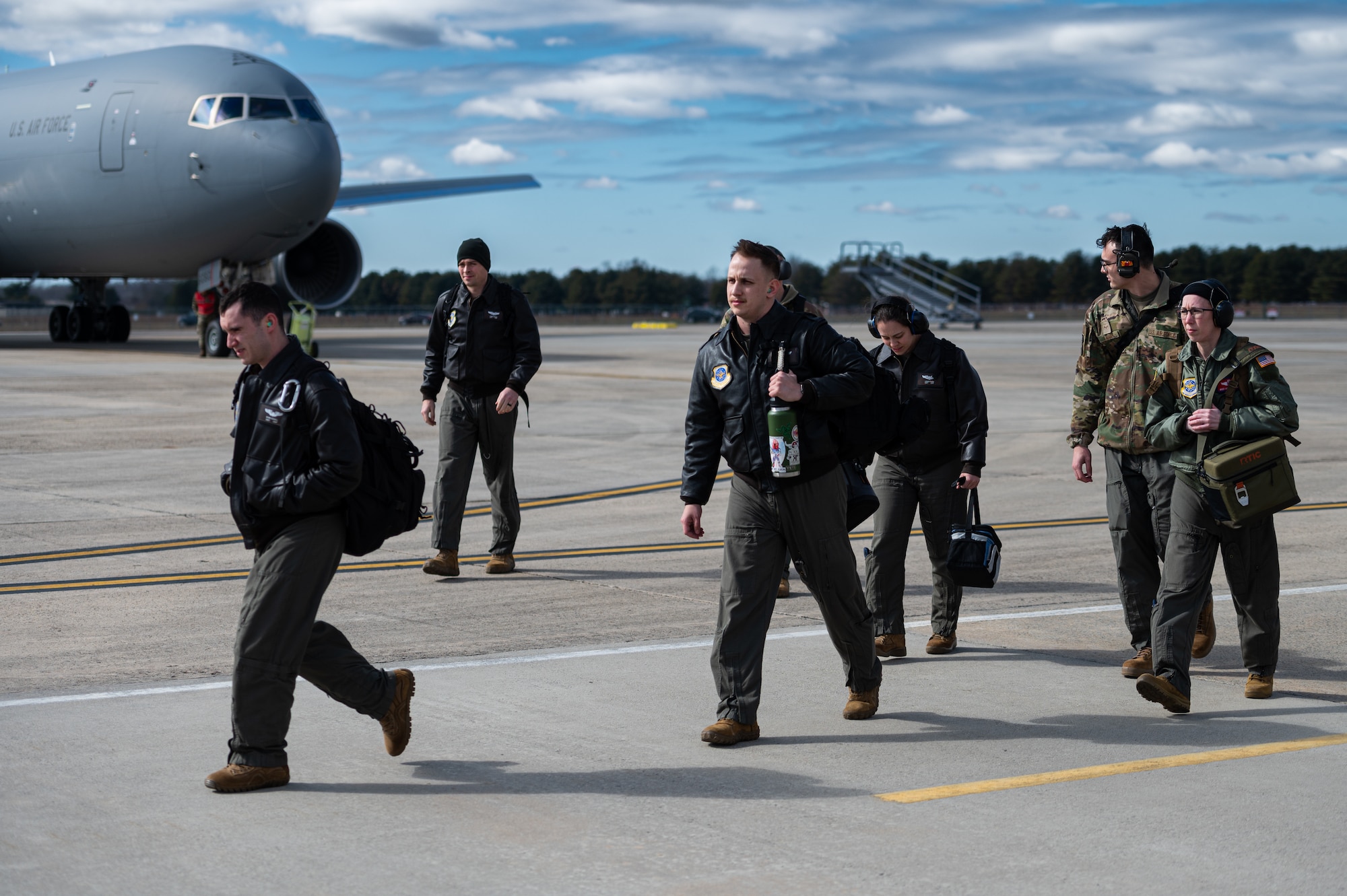 U.S. Air Force Airmen assigned to the 305th Air Mobility Wing conduct an Engine Running Crew Change (ERCC) during exercise White Stag at Joint Base McGuire-Dix-Lakehurst, N.J., March 8, 2023.