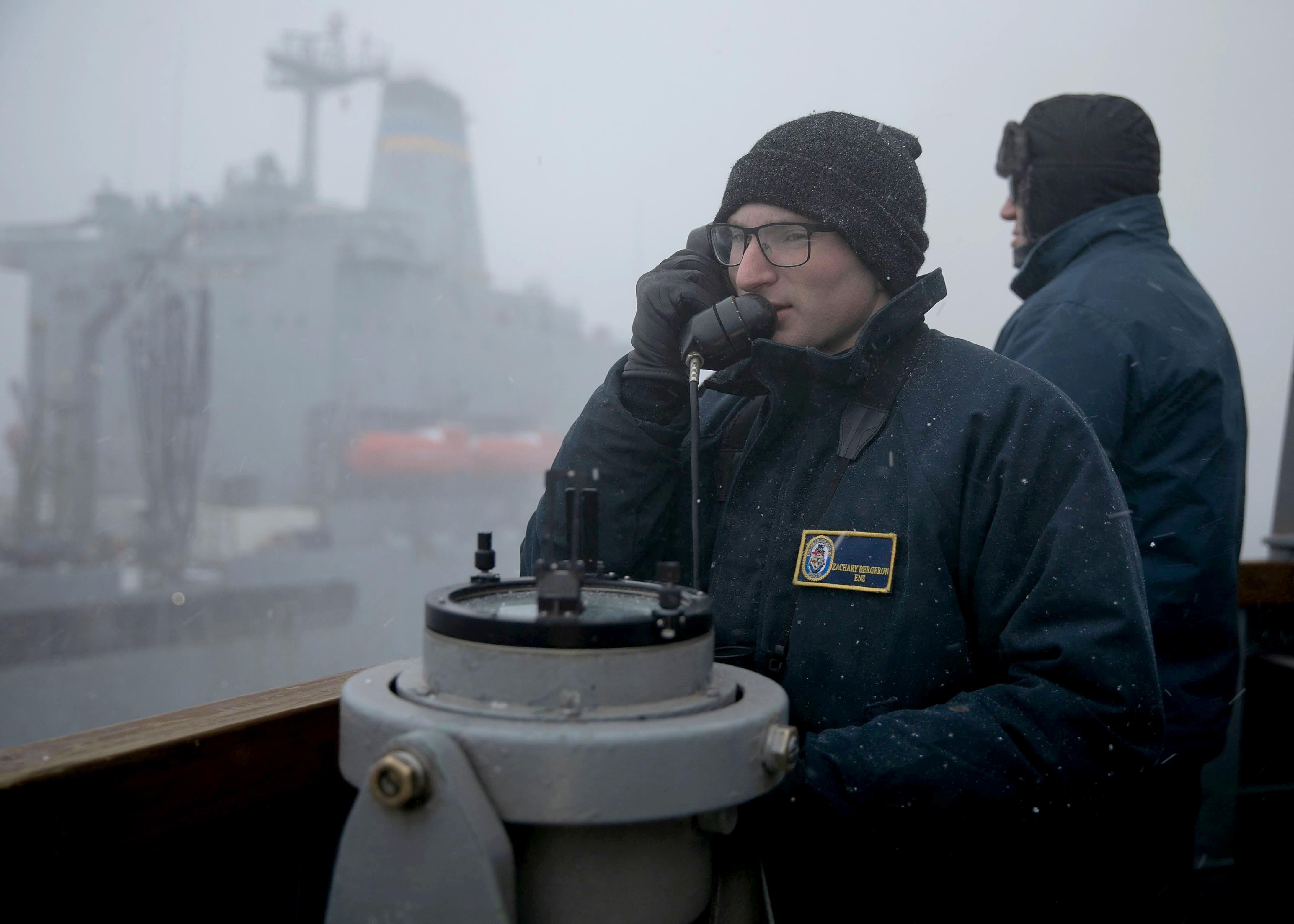 Ensign Zachary Bergeron mans his station aboard USS Arleigh Burke (DDG 51) during a refueling at sea.