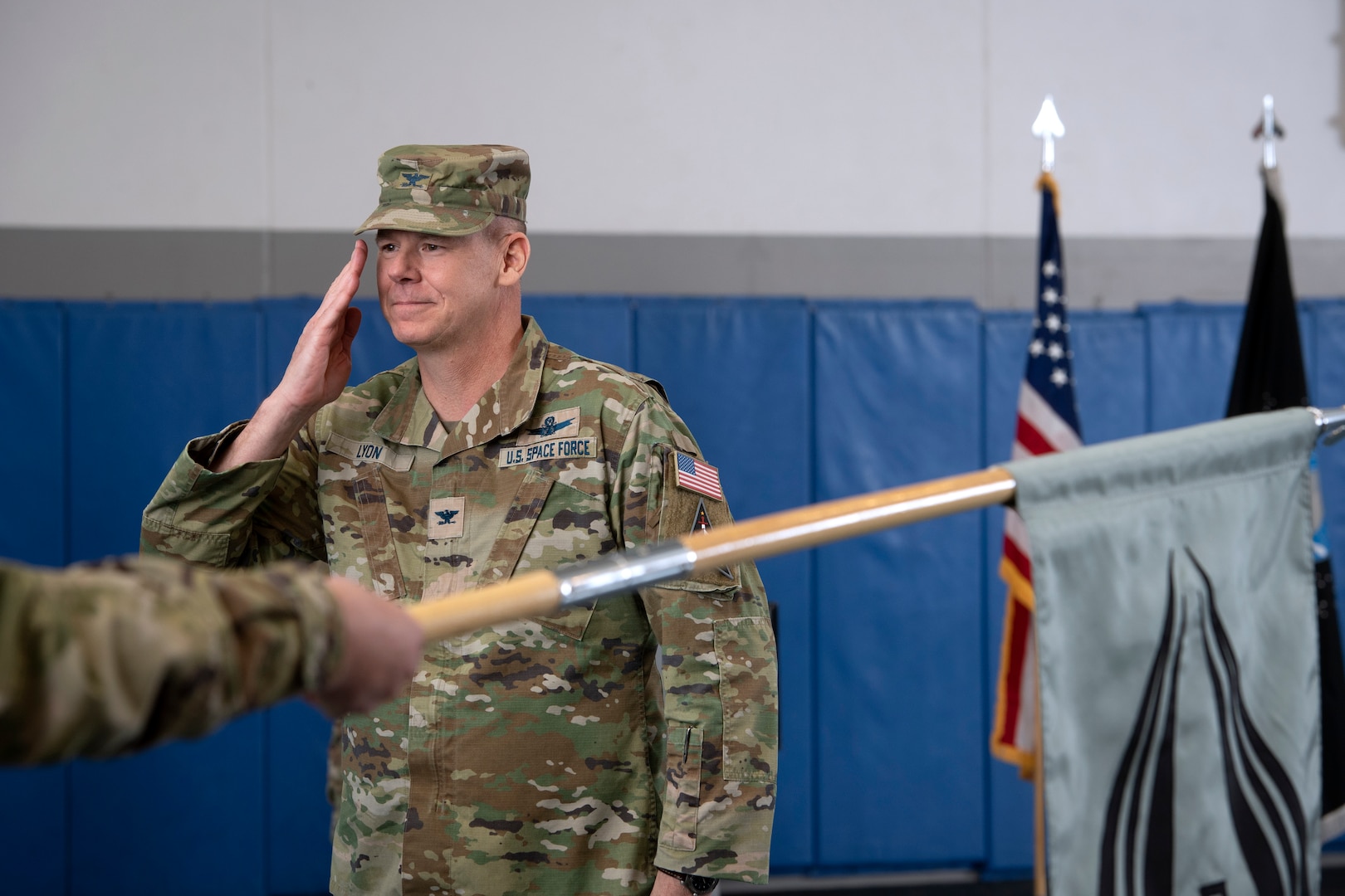 Man in uniform saluting