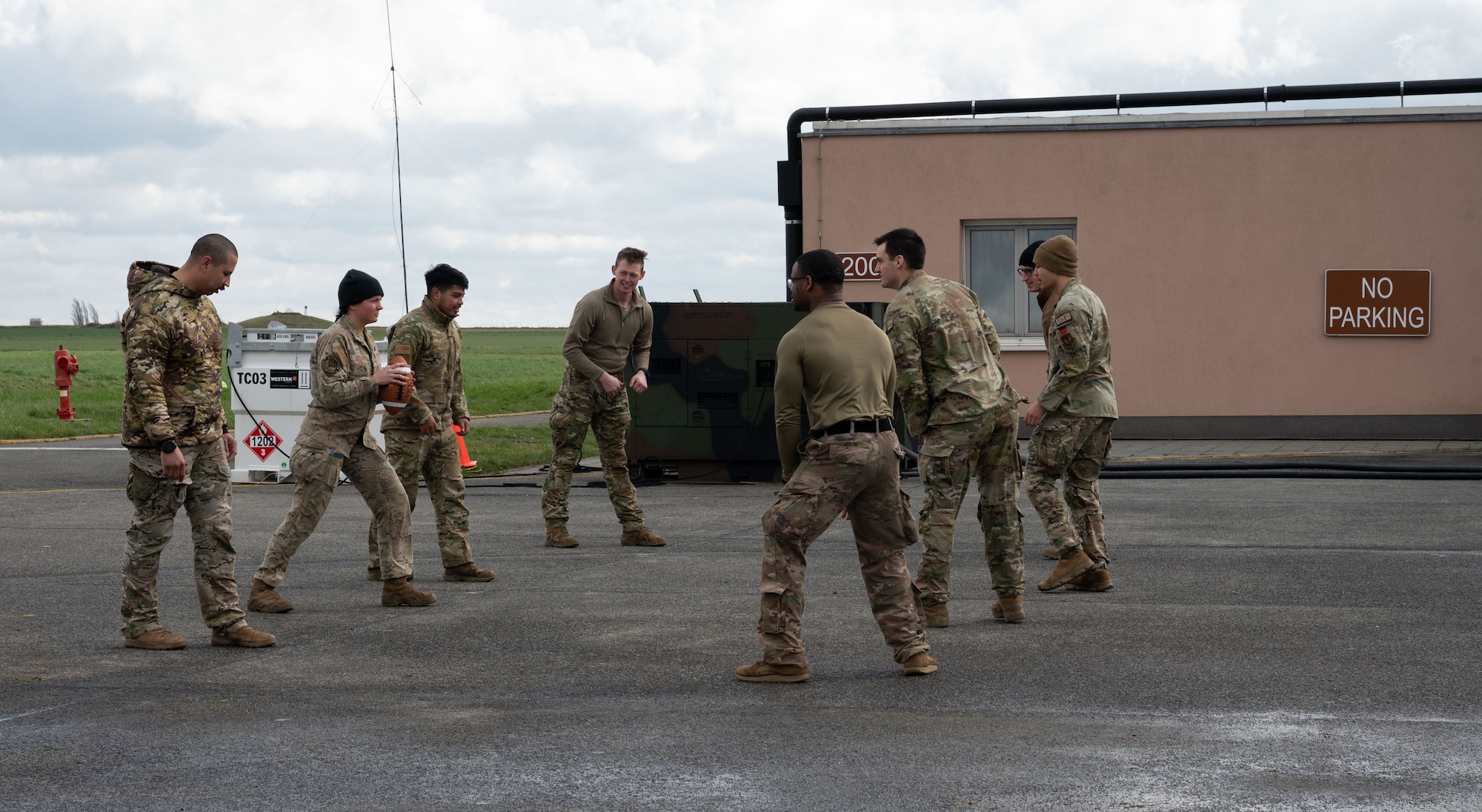 Members of the 435th Contingency Response Group play football during their down time to keep morale up during Exercise Agile Bison at Chièvres Air Base, Belgium, March 13, 2023.