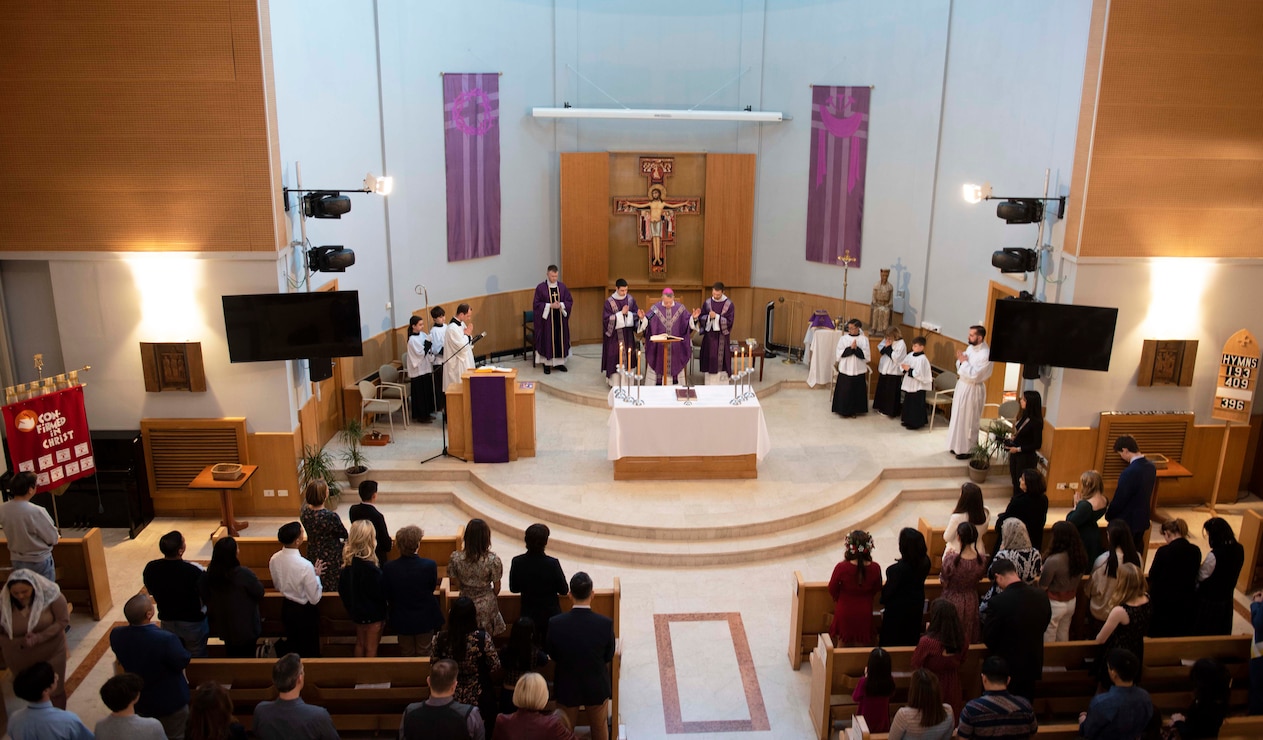 Roman Catholic Archbishop Timothy Broglio from the Archdiocese for the Military Services, center, leads Catholic mass at the chapel onboard U.S. Naval Support Activity (NSA) Naples in Gricignano di Aversa, Italy, March 4, 2023.