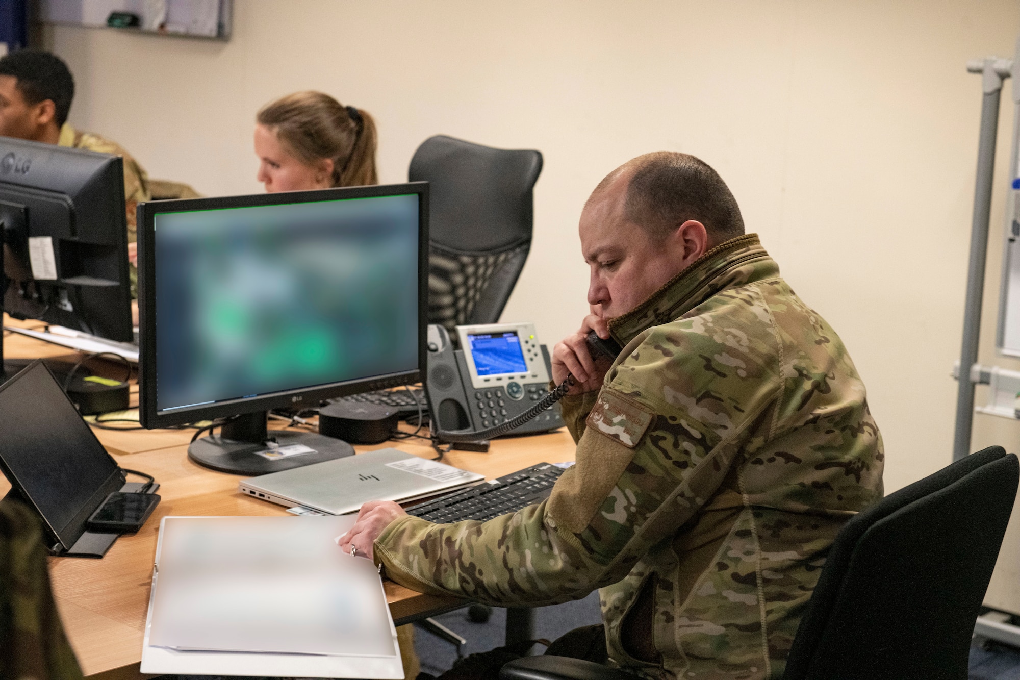 Tech. Sgt. Anthony Pinaula, 423d Security Forces Squadron resource advisor, works at the Emergency Operations Center (EOC) at RAF Alconbury,