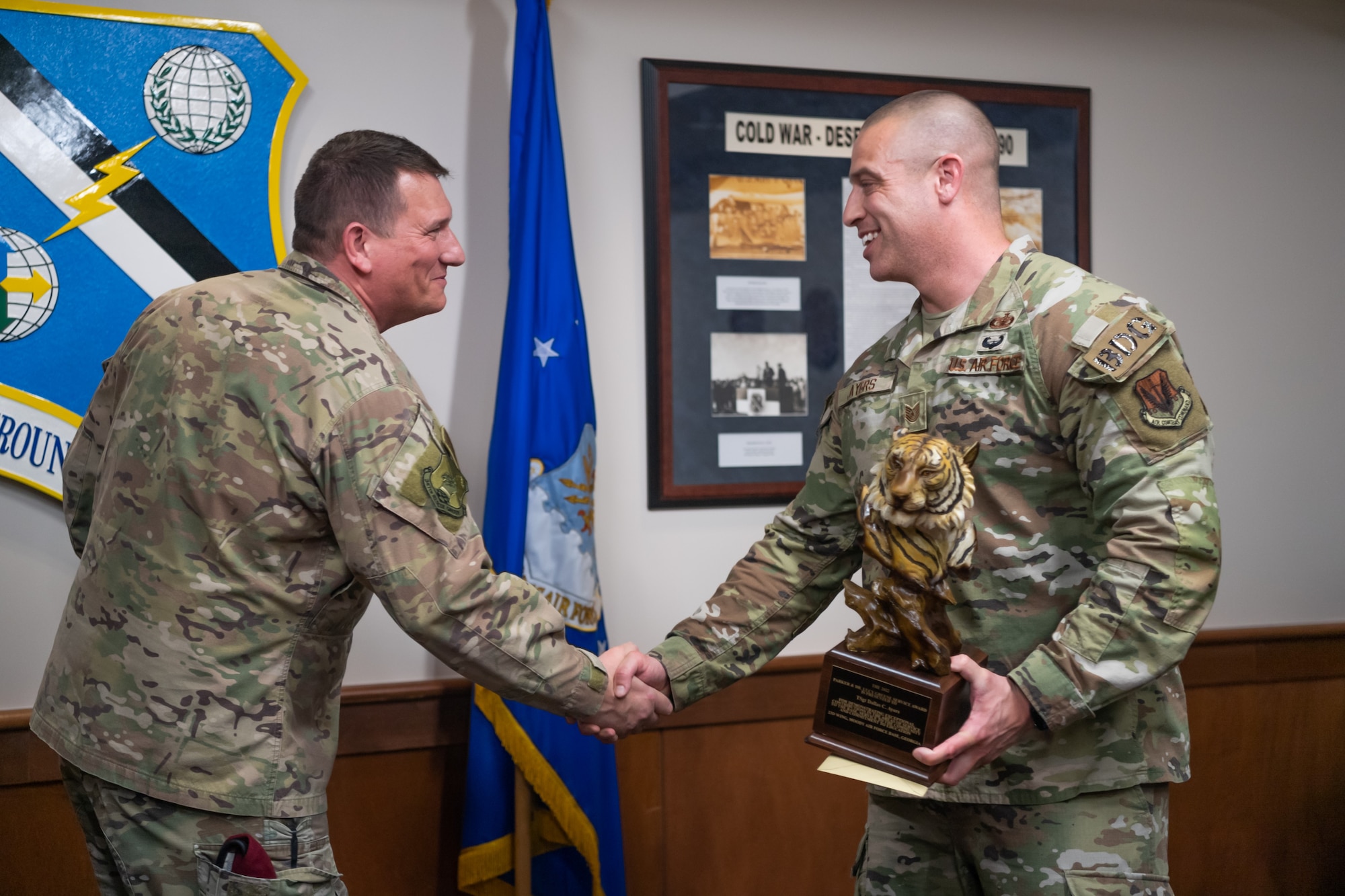 Airman shakes hands