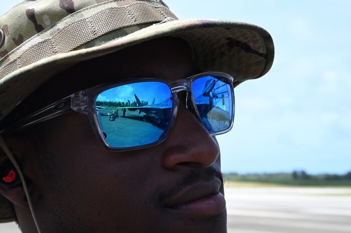 An F-22 Raptor assigned to the 525th Expeditionary Fighter Squadron, Kadena Air Base, Japan, can be seen in the reflection of the sunglasses of Staff Sgt. Von Peoples, an F-22 dedicated crew chief assigned to the 525th Expeditionary Fighter Squadron, during Exercise Agile Reaper 23-1 at Tinian International Airport, Northern Mariana Islands, March 3, 2023. AR 23-1 is the 3rd AEW’s effort to exercise Agile Combat Employment, rehearse capabilities in an operationally relevant environment and to provide air dominance, global mobility and command and control in the Indo-Pacific region. (U.S. Air Force photo by Tech. Sgt. Hailey Staker)