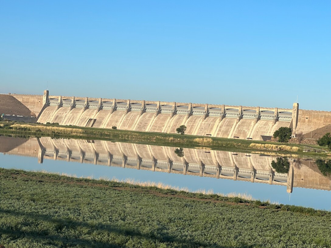 JOHN MARTIN DAM, Colo. – The John Martin Dam Spillway reflects in the calm morning waters of Lake Hasty, June 25, 2022. Photo by Chris Carroll.
