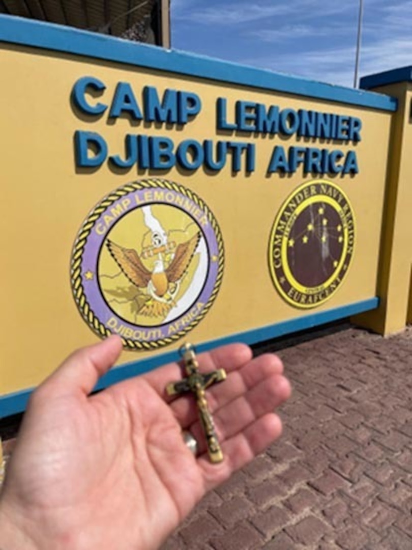 New York Army National Guard Lt. Col. Shawn Tabankin, the commander of the 1st Battalion, 69th Infantry, holds the "Kilmer Cross" at Camp Lemonnier, Djibouti, where the battalion is stationed while on duty at locations in the Horn of Africa. The crucifix was the property of poet Joyce Kilmer, who died while serving in the 69th Infantry in World War I.