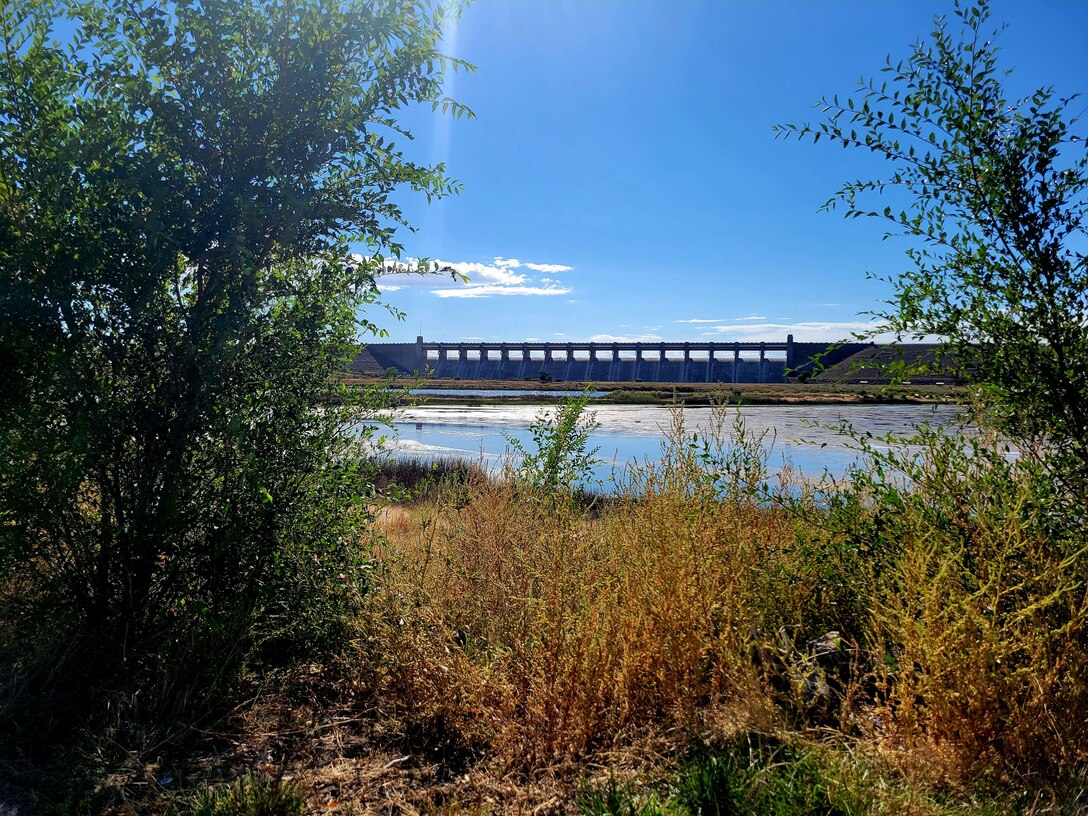 JOHN MARTIN DAM, Colo. – The dam as seen from the vegetation line at Lake Hasty, Sept. 27, 2022. Photo by Holly Garnett.