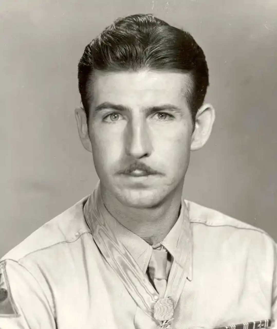 A man looks at the camera for a photo.