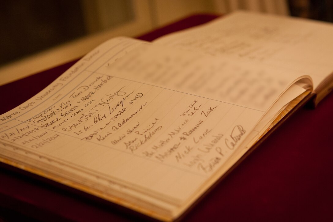 A guest book displayed during a dinner at the Home of the Commandants in honor of the Marine Corps University Foundation board of trustees and honored guests at Marine Barracks Washington in Washington, Feb. 21, 2014. (U.S. Marine Corps photo by Cpl. Tia Dufour/Released)