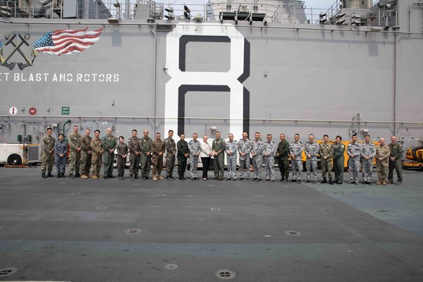 Capt. Tony Chavez, commanding officer of amphibious assault ship USS Makin Island (LHD 8) and Ms. Gwendolyn Cardno, deputy chief of mission at the U.S. embassy in Thailand, center, pose for a photo with leaders from Amphibious Squadron (CPR) SEVEN, Makin Island, 13th Marine Expeditionary Unit (MEU) and members of the Royal Thai navy and Republic of Korea navy, on the flight deck during exercise Cobra Gold 2023 (CG 23), March 3, 2023 in the Gulf of Thailand. Cobra Gold promotes interoperability and contributes to the operational readiness of all the militaries involved, a gained training value, and relationships developed by our service members at every level, fostering a spirit of cooperation and goodwill. The Makin Island Amphibious Ready Group, comprised of Makin Island (LHD 8) and amphibious transport dock USS Anchorage (LPD 23) and USS John P. Murtha (LPD 26), is operating in the U.S. 7th Fleet area of operations with the embarked 13th Marine Expeditionary Unit to enhance interoperability with Allies and partners and serve as a ready-response force to defend peace and maintain stability in the Indo-Pacific region. (U.S. Navy photo by Mass Communication Specialist 2nd Class Nadia Lund)