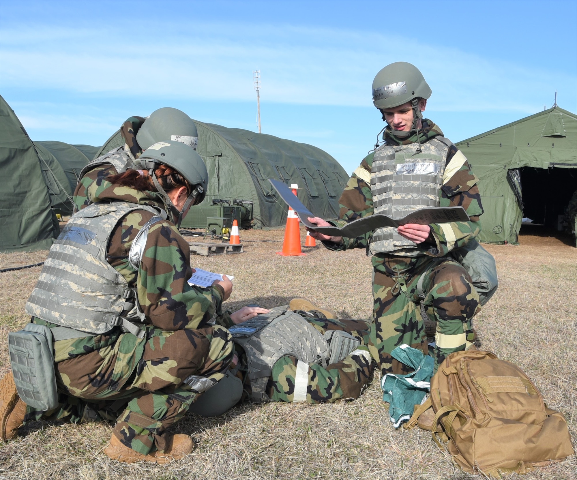 Airmen from the 931st Air Refueling Wing examine a "wounded" exercise participant March 5.
