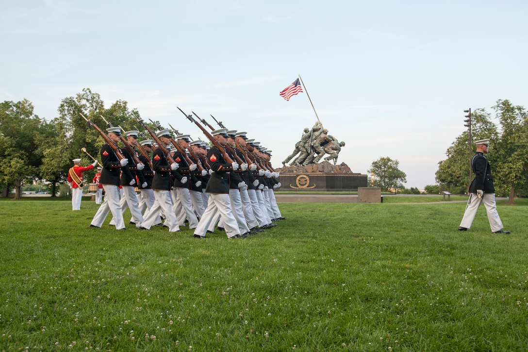 U.S. Marines with Marine Barracks Washington, pass in review during the sunset parade at the Marine Corps War Memorial, Arlington, Va., May 31, 2016. Sunset parades are held as a means of honoring senior officials, distinguished citizens and supporters of the Marine Corps. (U.S. Marine Corps photo by Cpl. Samantha K. Draughon/Released)