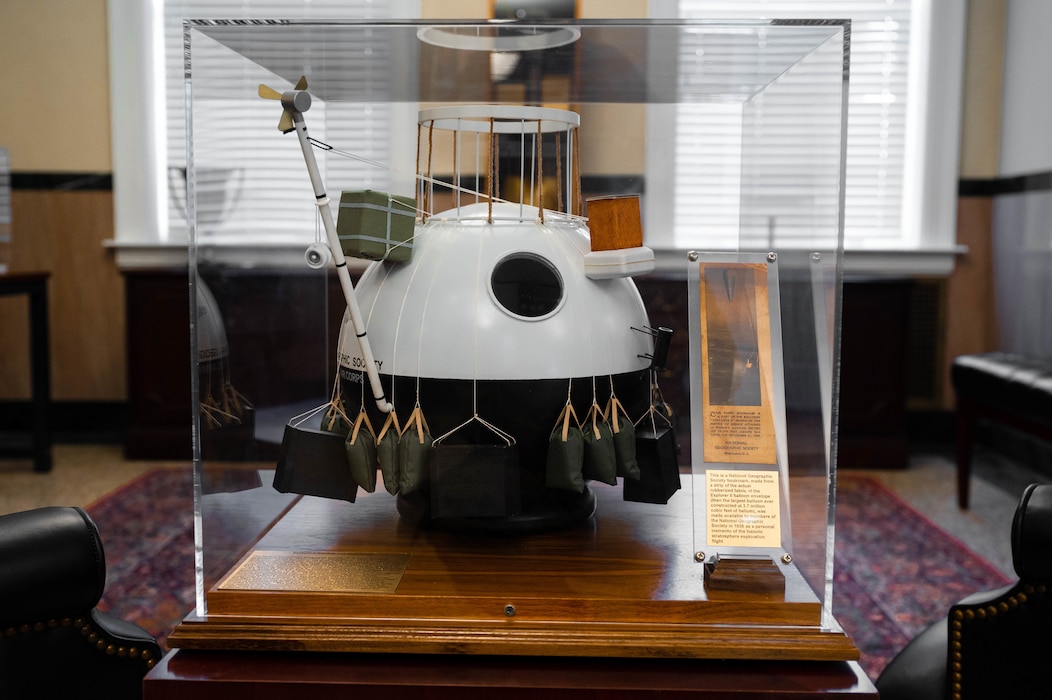A model of the U.S. Army Air Corps Explorer II balloon sits on display at the 375th Air Mobility Wing headquarters building on March 6, 2023. Marc Hornkohl of the American Model Builders and Kris Matthews, 375th AMW historian, delivered a model of the U.S. Army Air Corps Explorer II balloon to the 375th Air Mobility Wing Headquarters, adding to the collection of the wing heritage program. (U.S. Air Force photo by Airman 1st Class De’Quan Simmons)