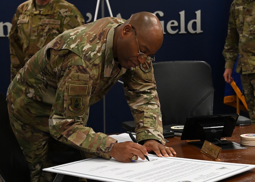 Col. Todd E. Randolph, 316th Wing and installation commander, signs the annual Sexual Assault Awareness and Prevention Month proclamation at Joint Base Andrews, Md., March 15, 2023. The signed proclamation formally recognized April as the month to increase awareness and education regarding SAAP for the base's military and civilian members. (U.S. Air Force photo by Airman 1st Class Austin Pate)