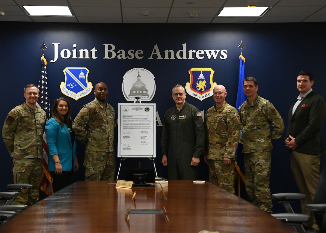 Senior leaders at Joint Base Andrews, Md., pose for a group photo following the annual Sexual Assault Awareness and Prevention Month proclamation signing on March 15, 2023. The leaders signed the proclamation to formally recognize April as the month to increase awareness and education about sexual assault awareness and prevention for the military community at JBA. (U.S. Air Force photo by Airman 1st Class Austin Pate)