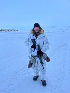 U.S. Army Staff Sgt. Shane Yuknis, cavalry scout for B Troop, 172nd Cavalry Squadron (MTN), 86th Infantry Brigade Combat Team (MTN), Vermont Army National Guard, poses for a photograph prior to tactical insertion training at the airfield in Resolute, Nunavut, Canada, March 14, 2023.