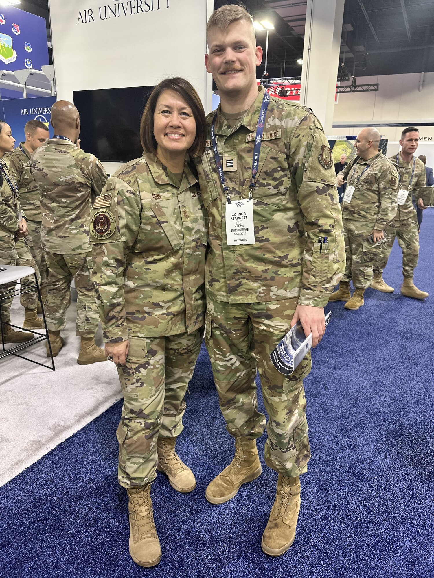 Cadet Connor Starrett from Air Force ROTC Detachment 780 at South Dakota State University meets Chief Master Sgt. of the Air Force JoAnne Bass (left) at the Air and Space Forces Association Air Warfare Symposium, Aurora, Colorado, March 6, 2023. Cadets had the opportunity to meet senior Air and Space Force leadership at the symposium