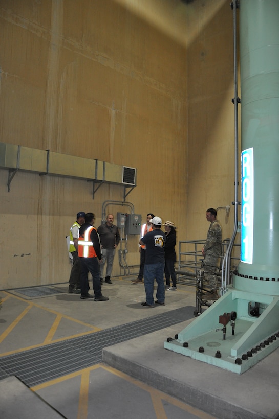 Travis Tutka, visits the deep interior of Prado Dam, March 9, at Corona, California. “Seeing presentations of the project never do it justice to see the scale of the economy and residences downstream,” he said. Tutka was updated on future safety improvements to the Prado Dam spillway.