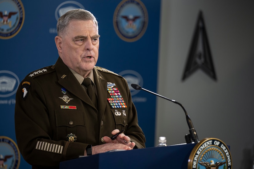 A man speaks from a podium.