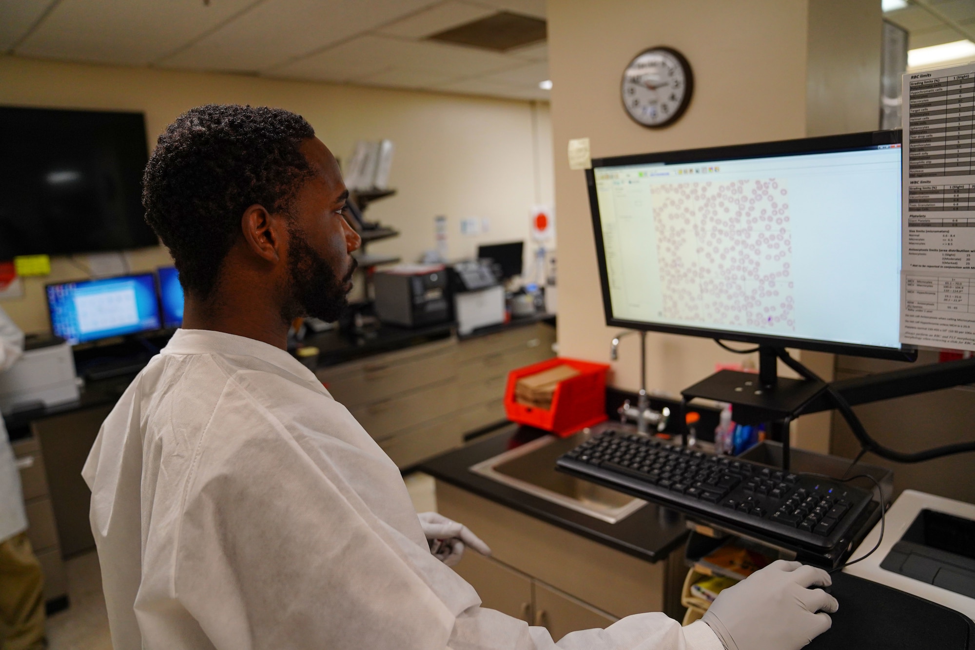 U.S. Air Force Senior Airman Ashton Johnson, 81st Medical Diagnostic and Therapeutics Squadron medical laboratory technician, reviews blood samples for deficiencies at the Keesler Medical Center on Keesler Air Force Base, Mississippi, Feb. 28, 2023.