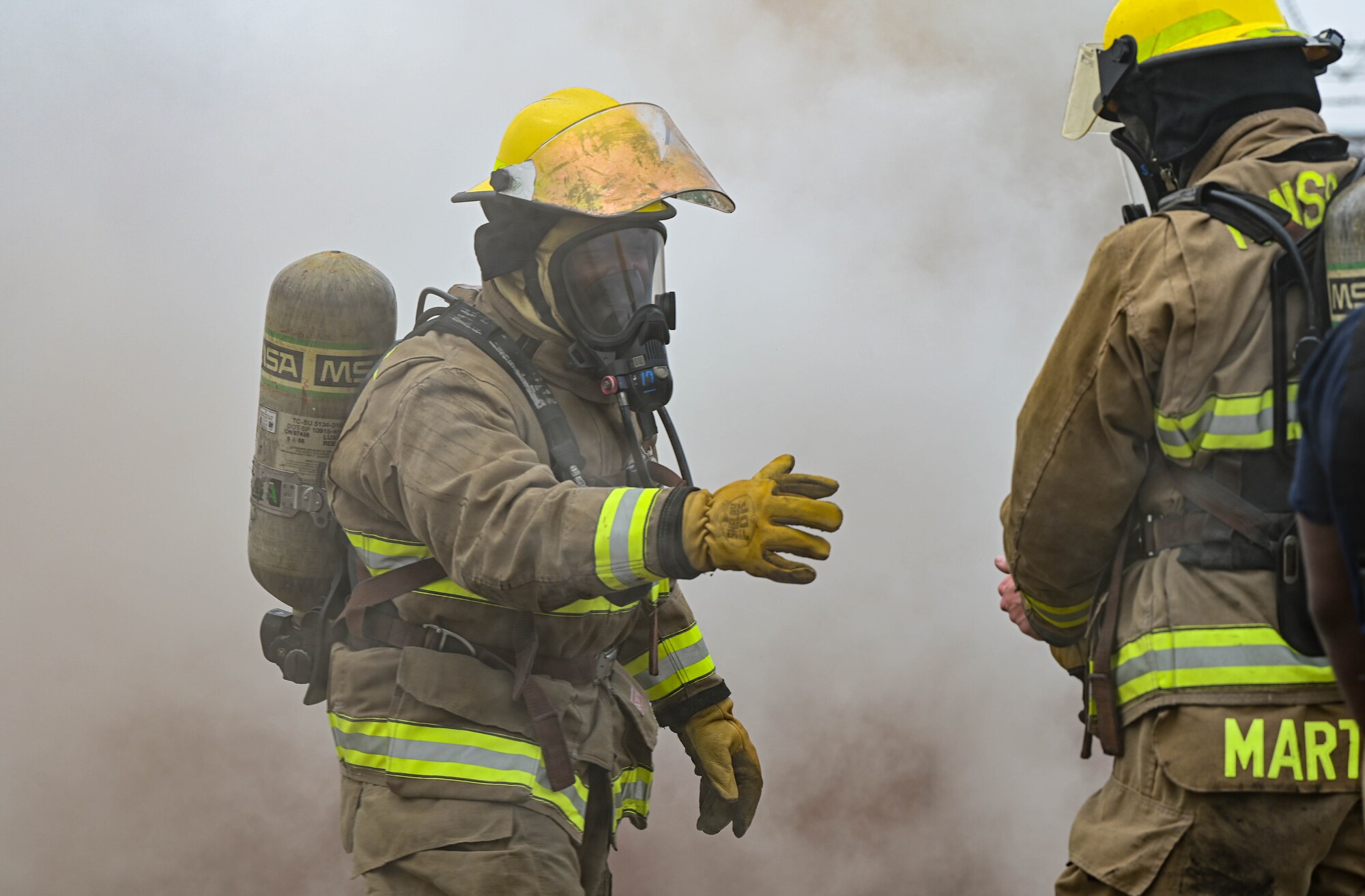 U.S. Marine Corps Cpl. Steven Brooks, Marine Wing Support Squadron 172 firefighter, extends his hand to another firefighter during a joint training event at Kunsan Air Base, Republic of
Korea, Mar. 9, 2023. Firefighters from the 8th Civil Engineer Squadron trained with MWSS 172 firefighters, based out of Okinawa, Japan, in various fire suppression and rescue techniques. (U.S. Air Force photo by Senior Airman Shannon Braaten)