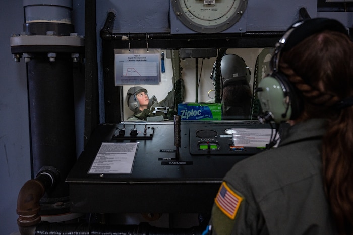 U.S. Air Force  Airman from the aerospace physiology team at Laughlin Air Force Base, Texas, conduct altitude chamber training with students on Feb. 24, 2023. The altitude chamber is one of the first training steps for all new pilots and aircrew to demonstrate and know the symptoms of hypoxia. (U.S. Air Force photo by Senior Airman David Phaff)