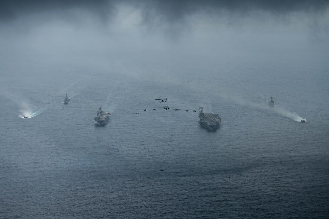 Ships and aircraft from Nimitz Carrier Strike Group (NIMCSG) and Makin Island Amphibious Ready Group (MKI ARG), with embarked 13th Marine Expeditionary Unit (MEU), operate in formation in the South China Sea. NIMCSG, MKI ARG and 13th MEU, are conducting combined expeditionary strike force (ESF) operations, demonstrating unique high-end war fighting capability, maritime superiority, power projection and readiness. Operations include integrated training designed to advance interoperability between the two groups while simultaneously demonstrating the U.S. commitment to our alliances and partnerships in the Indo-Pacific region.