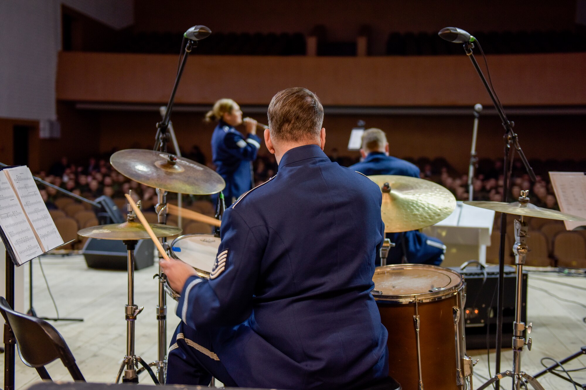 A man plays a drumset