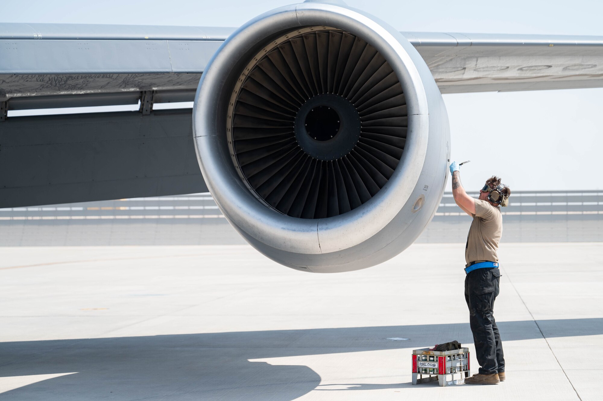 In this photo, an Airman performs routine maintenance on a KC-135 Stratotanker.