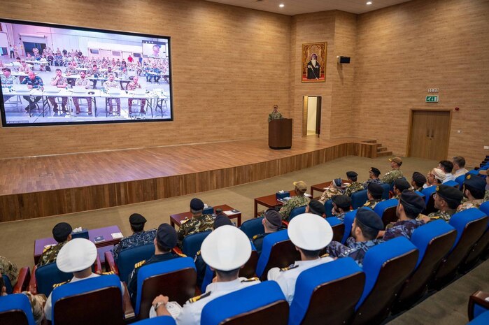 230316-N-EG592-1001 MUSCAT, Oman (March 16, 2023) International Maritime Exercise (IMX) 2023 participants conclude the exercise during a final briefing and ceremony in Muscat, Oman, with virtual attendees watching via video teleconference from the IMX Maritime Operations Center in Manama, Bahrain, March 16, 2023.