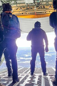 Guardian Angels of 212th Rescue Squadron exit a 211th Rescue Squadron HC-130J Combat King II during a training exercise. Members of the 212th RQS jumped from a 211th RQS HC-130J into Pilot Station, Alaska, March 8, 2023, and evacuated a critically injured patient on a 210th Rescue Squadron HH-60G Pave Hawk.