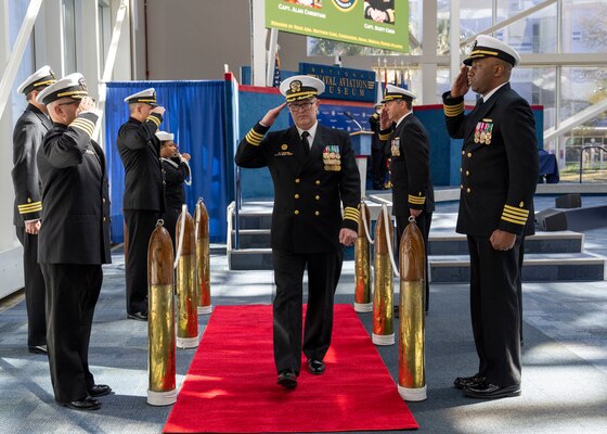 230315-N-LY160-1470 PENSACOLA, Fla. (March 15, 2023) – Capt. Scott D. Coon, commanding officer of Navy Medicine Readiness and Training Command Pensacola and director of Naval Hospital Pensacola, salutes sideboys during a change of command ceremony at the National Naval Aviation Museum in Naval Air Station Pensacola, March 15. (U.S. Navy photo by Mass Communication Specialist 1st Class Michael H. Lee)