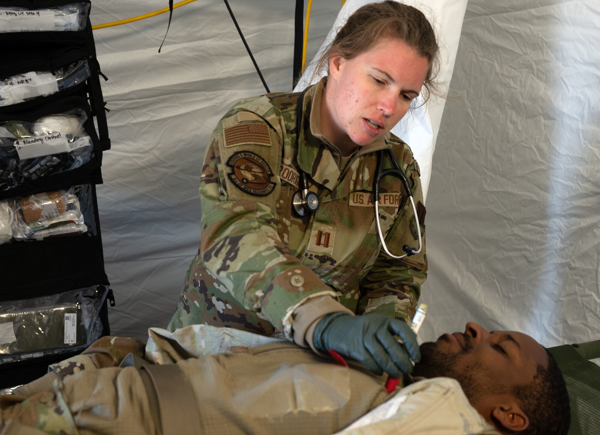 Capt. Karen Rodriguez, 4th Operational Medical Readiness Squadron flight doctor, triages a simulated patient as part of a mass casualty event during exercise Agile Cub 4 at Marine Corps Air Station Cherry Point, North Carolina, March 8, 2023. The exercise scenario allowed medics assigned to the 4th Medical Group to receive advanced combat medical training in a deployed environment to ensure they are ready for any incident. This agile combat employment exercise shifts the generation of airpower from large, centralized bases to networks of smaller, dispersed locations.