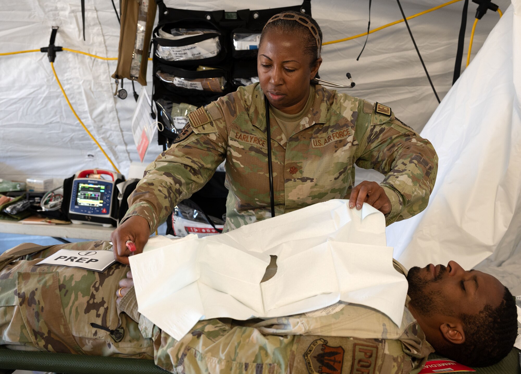 Maj. Shannon Earlyrice, 4th Medical Group nurse, prepares a simulated patient for treatment as part of a mass casualty event during exercise Agile Cub 4 at Marine Corps Air Station Cherry Point, North Carolina, March 8, 2023. The exercise scenario allowed medics assigned to the 4th Medical Group to receive advanced combat medical training in a deployed environment to ensure they are ready for any incident. This agile combat employment exercise shifts the generation of airpower from large, centralized bases to networks of smaller, dispersed locations.