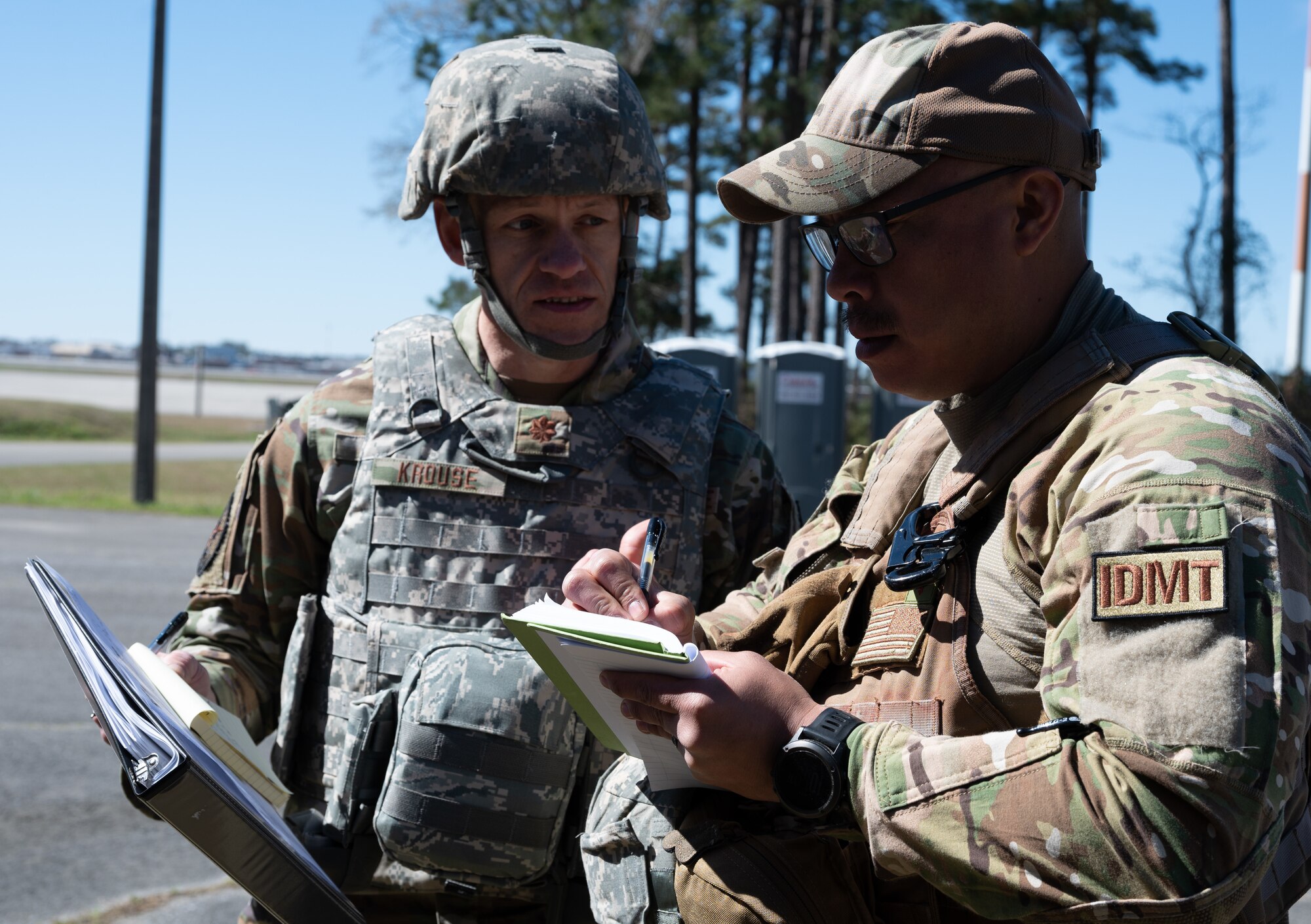 Maj. Nathaniel Krouse, left, 4th Medical Group, relays patient information to Master Sgt. Humberto Alcocer, 4th Medical Group individual medical technician, as part of a mass casualty event during exercise Agile Cub 4 at Marine Corps Air Station Cherry Point, North Carolina, March 8, 2023. The exercise scenario allowed medics assigned to the 4th Medical Group to receive advanced combat medical training in a deployed environment to ensure they are ready for any incident. This agile combat employment exercise shifts the generation of airpower from large, centralized bases to networks of smaller, dispersed locations.