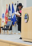 Keynote speaker Rev. Dr. Lorina Marshall-Blake reads to those in attendance at Troop Support's Women’s History Month Program in Philadelphia on March 8, 2023.